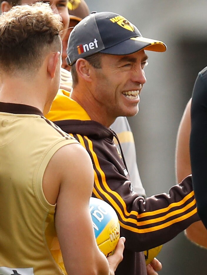 AFL 2016 Training - Hawthorn 050516 MELBOURNE, AUSTRALIA - MAY 5: Alastair Clarkson, Senior Coach of the Hawks shares a joke with his players during the Hawthorn Hawks training session at the Ricoh Centre in Melbourne on May 5, 2016. (Photo by Michael Willson/AFL Media)